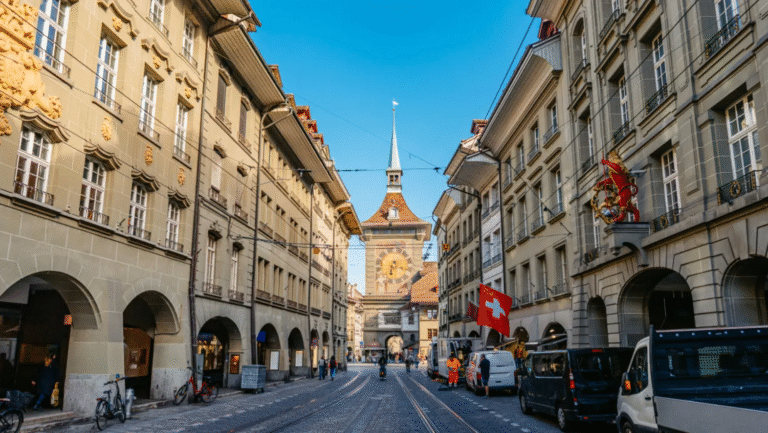 Zytglogge clock tower in Bern, Switzerland with Swiss flag.