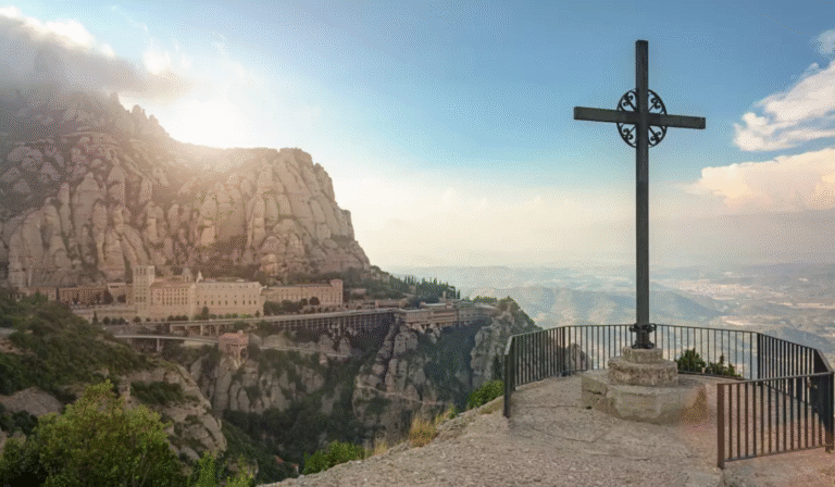 Montserrat Monastery with cross in foreground