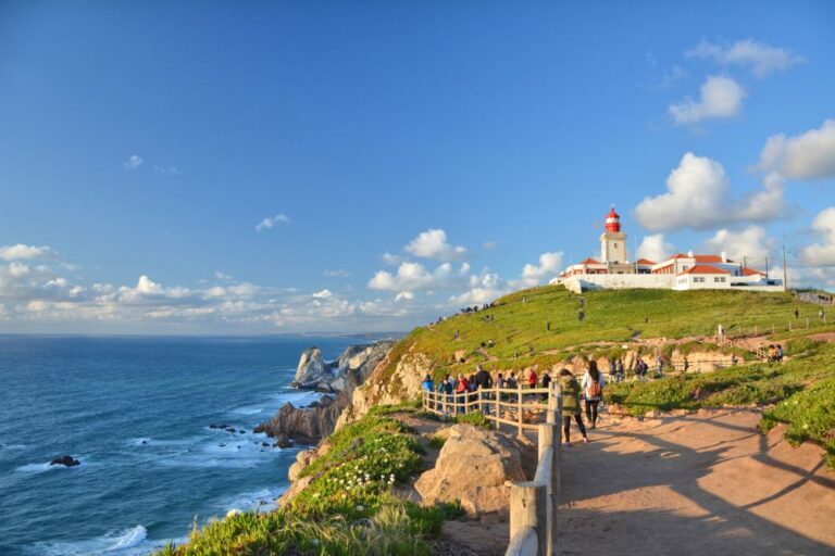 Cabo da Roca lighthouse with tourists and ocean view.