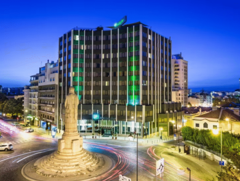 Holiday Inn Lisbon at night with city view