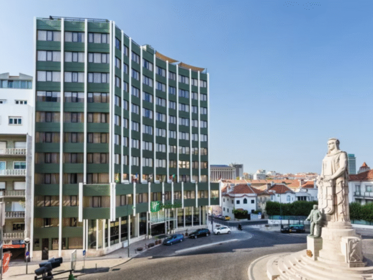 Holiday Inn Lisbon hotel with nearby statue