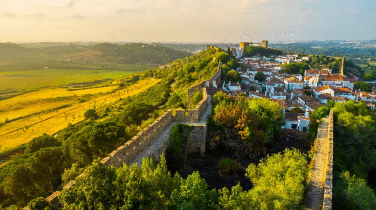 Aerial view of Óbidos, Portugal, with medieval walls and village.
