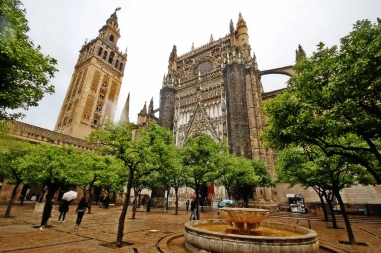 Seville Cathedral and Giralda Tower with fountain