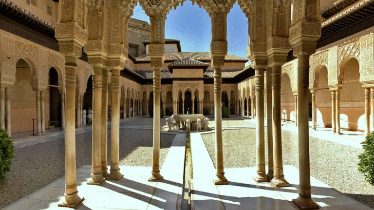 Alhambra Palace courtyard with carved columns and central fountain.