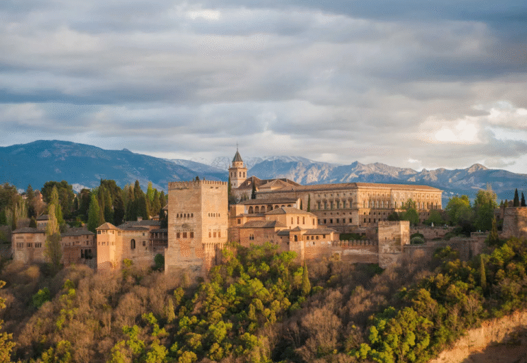 Alhambra Palace with mountainous backdrop