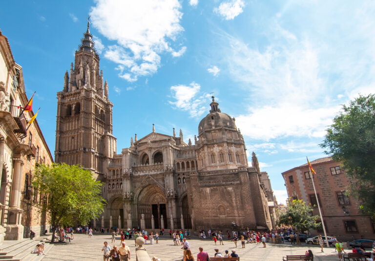 Toledo Cathedral with tourists in the plaza