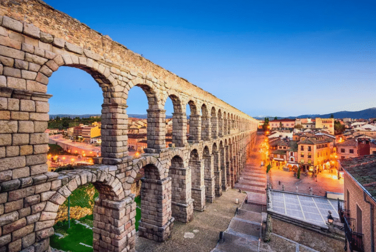 Ancient Roman Aqueduct of Segovia at dusk