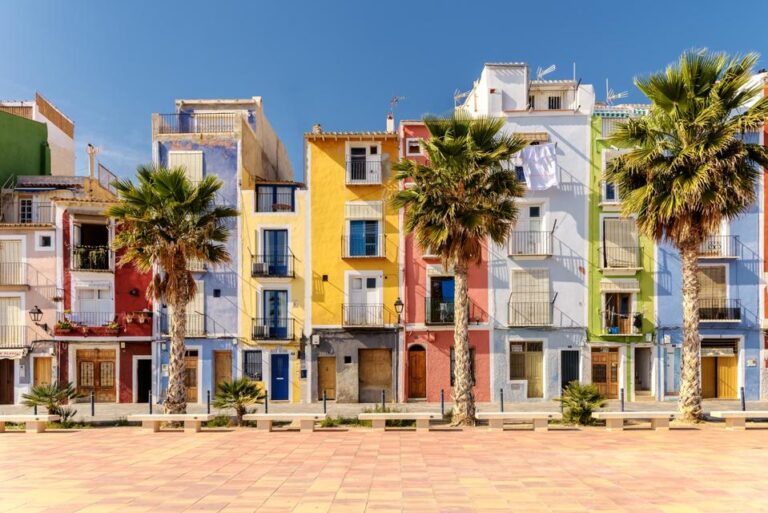 Colorful houses with palm trees in Villajoyosa, Spain