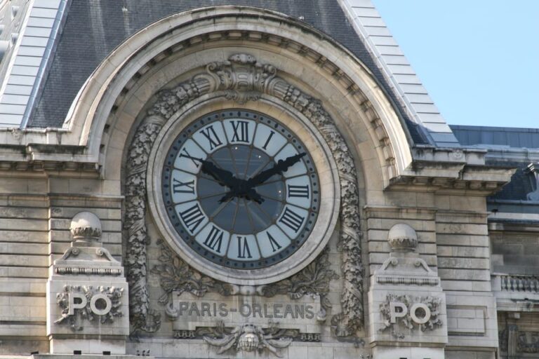 Ornate clock on the facade of Musée d'Orsay in Paris.