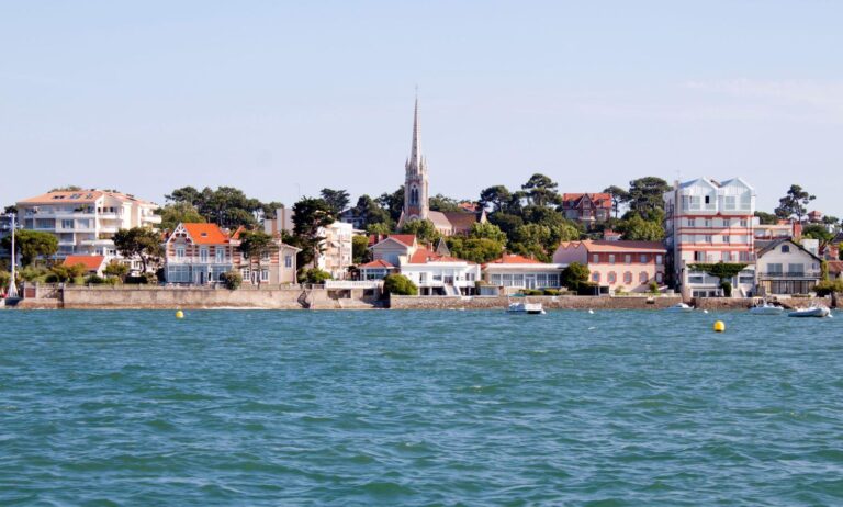 Arcachon Bay coastal town with church and residential buildings
