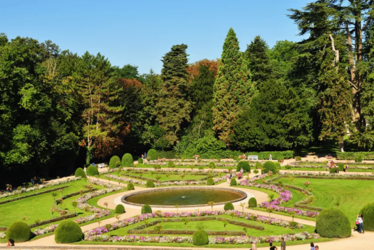 Chateau de Chenonceau gardens with lush greenery and pathways