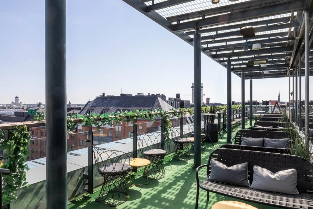 Rooftop bar with urban view and outdoor seating