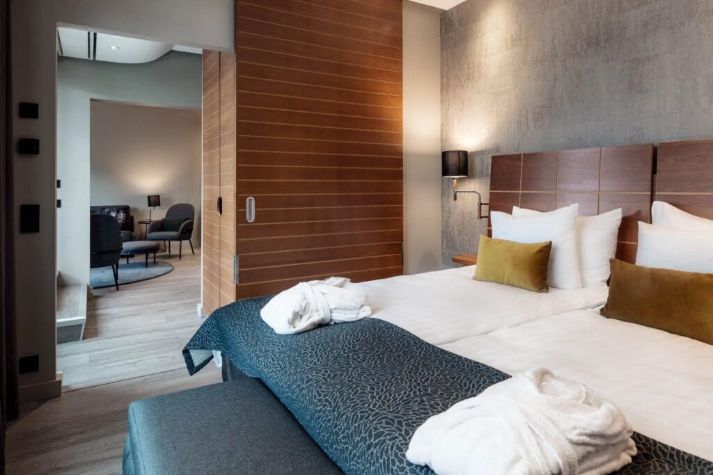Modern Scandinavian hotel room with minimalist design.