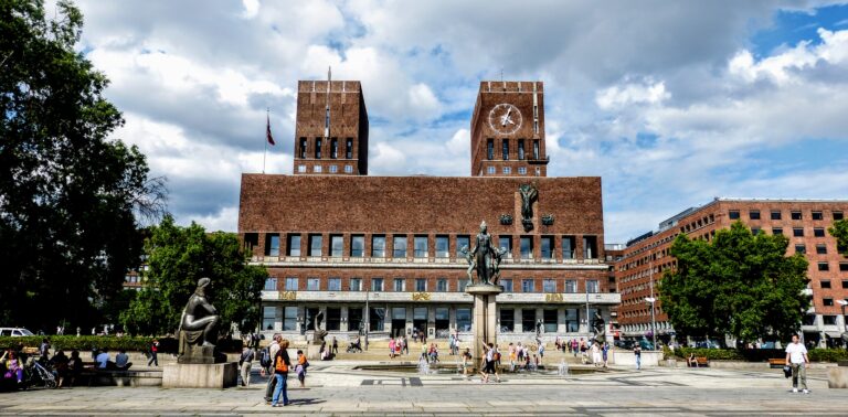 Oslo City Hall with clock towers and sculptures