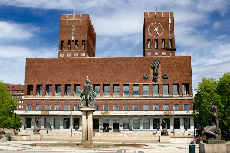 Oslo City Hall with sculptures and clock tower