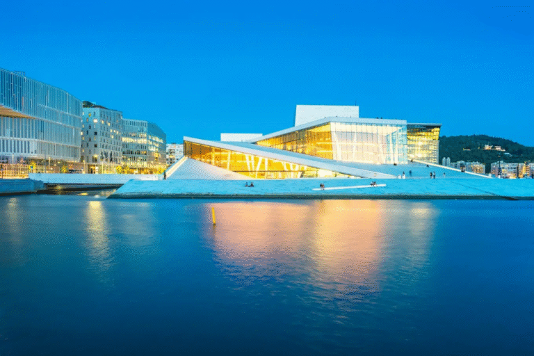 Oslo Opera House by the waterfront in the evening