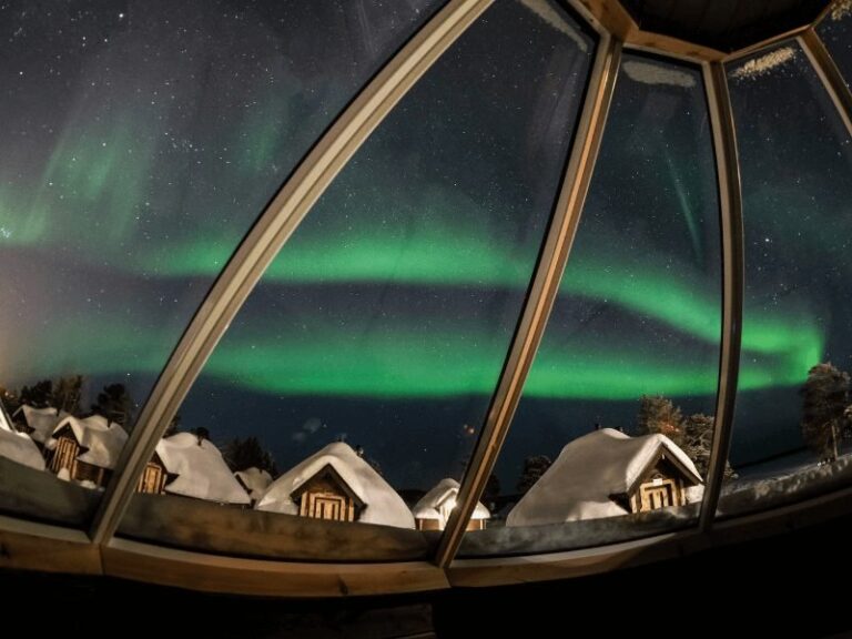 Northern lights view from glass cabin