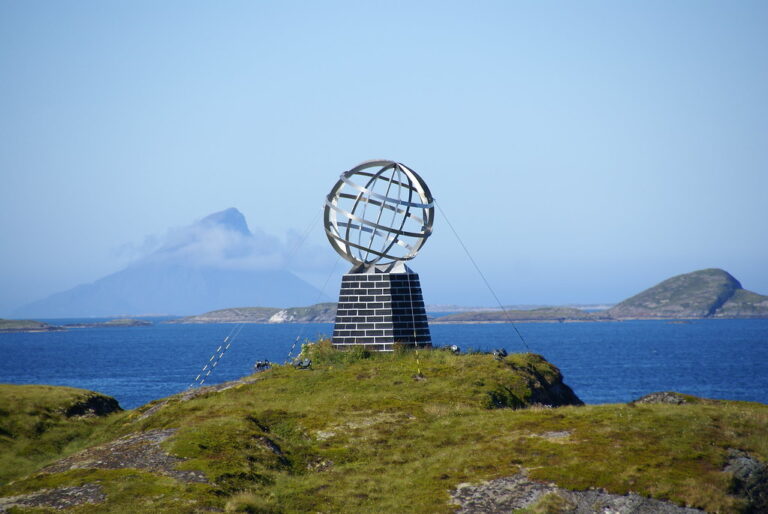 Arctic Circle Monument with ocean and mountains