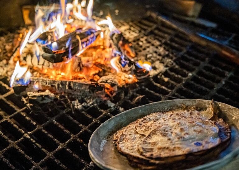 Traditional Arctic pancakes cooking over open fire