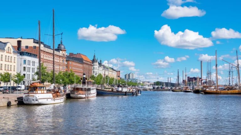 Scenic view of harbor with boats and historic architecture
