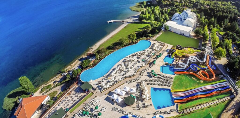 Aerial view of Izgrev Hotel and Spa with water park and lakeside.