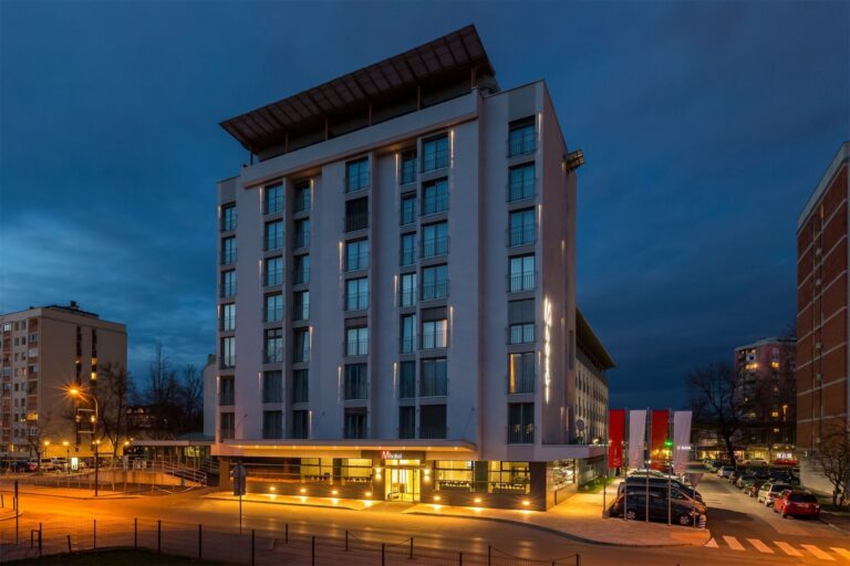 Night view of Balkan M Hotel in urban setting