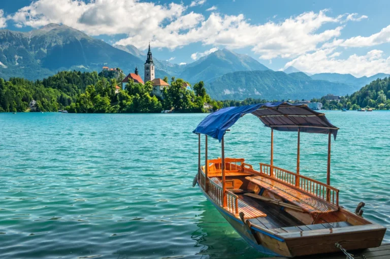 Traditional Pletna boat on Lake Bled with Bled Island in the background