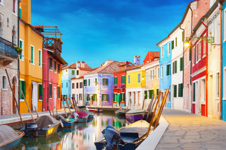 Colorful houses along a canal in Burano, Italy