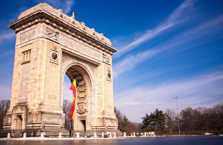 Arcul de Triumf in Bucharest under a blue sky