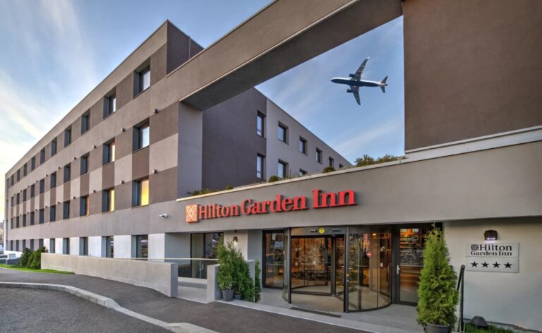Hilton Garden Inn near airport with airplane flying overhead