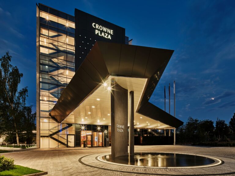 Crowne Plaza Hotel at night with modern architecture