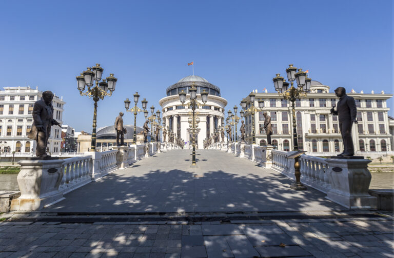 Skopje bridge with statues and historic architecture