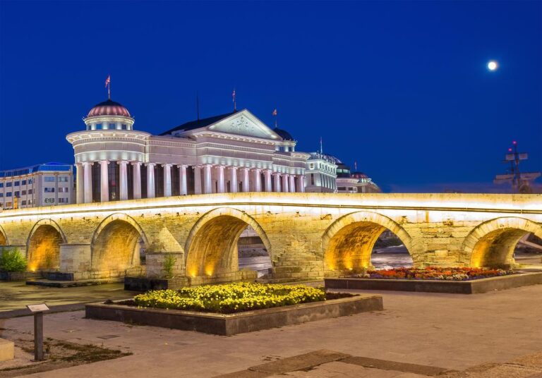 Stone Bridge illuminated at night in Skopje.