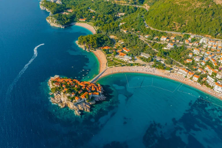 Aerial view of Budva's coastline and historic buildings