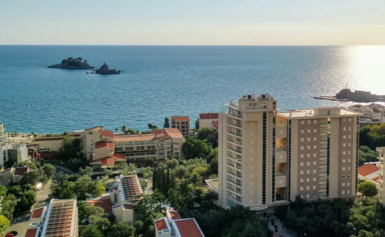Coastal view of Budva, Montenegro featuring the AMI Hotel and Adriatic Sea