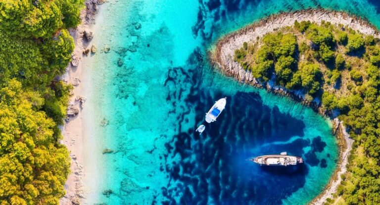 Aerial view of boats near a Croatian island coastline.