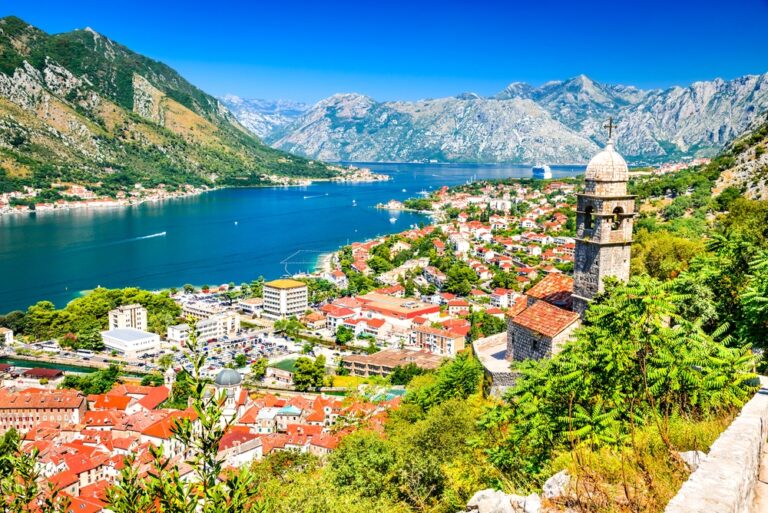 Scenic view of Kotor Bay with mountains and church tower