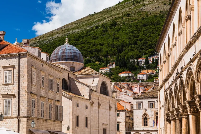 Historic architecture in Dubrovnik with mountain backdrop