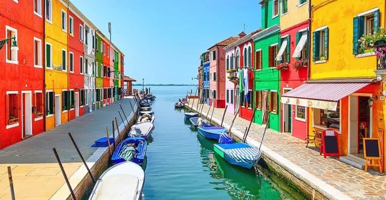 Colorful houses along a canal in Burano, Italy.