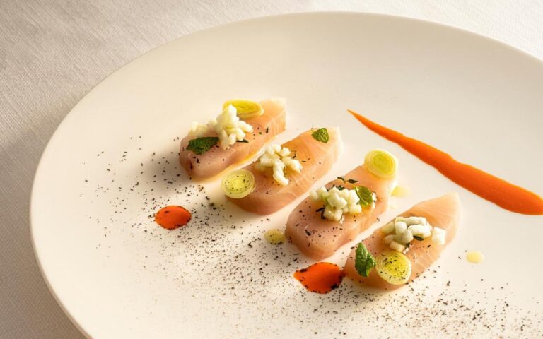 Gourmet salmon dish in fine dining setting