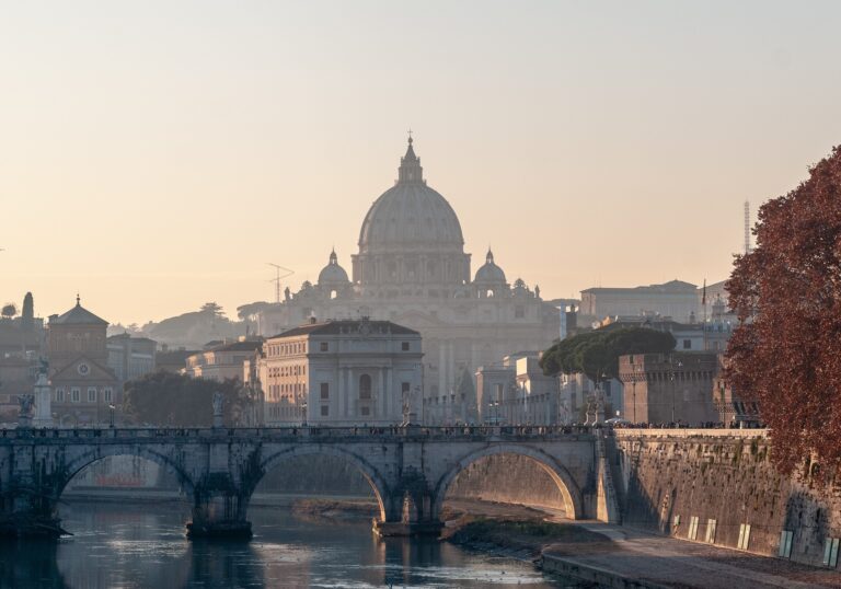View of St. Peter's Basilica and Tiber River bridge in Rome