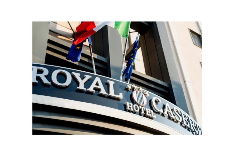 Entrance of Royal Caserta Hotel with flags