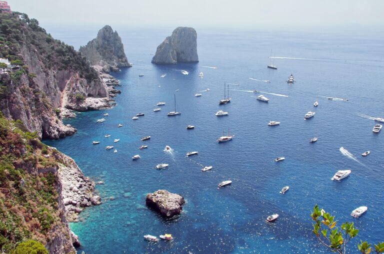 Boats near cliffs on Capri Island.