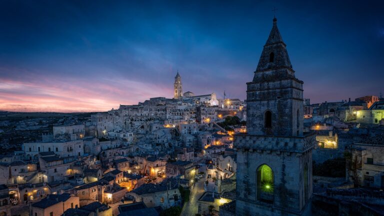 Matera cityscape at dusk with historic buildings