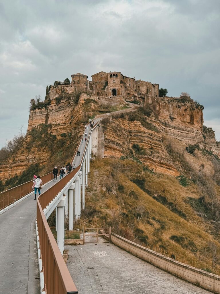 Civita di Bagnoregio with bridge and tourists