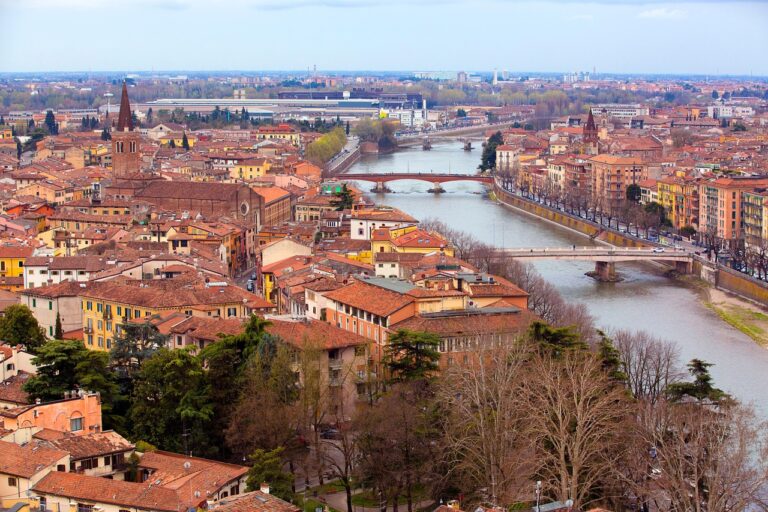 Aerial view of Verona with the Adige River and historic buildings.