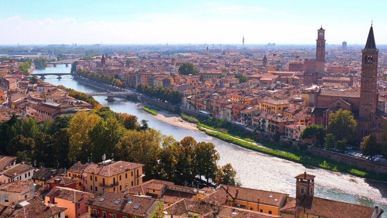 Panoramic view of Verona with the Adige River and historic architecture.