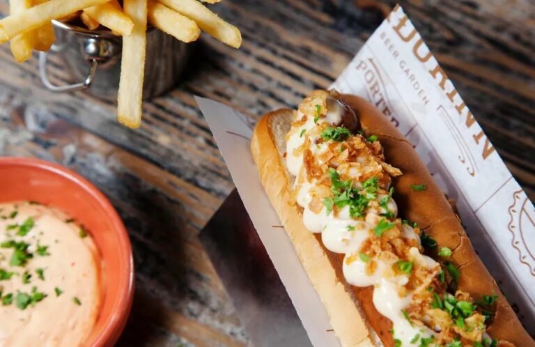 Gourmet hot dog with fries at Fosshotel