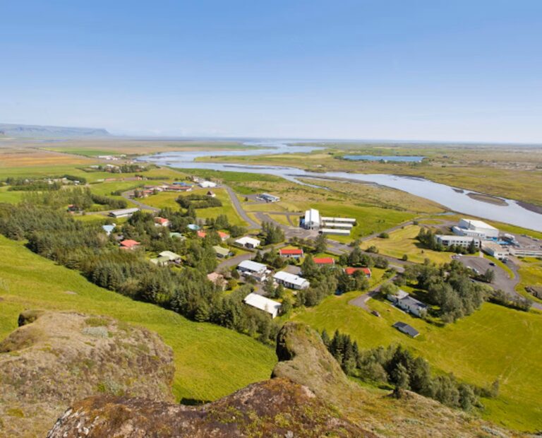 Aerial view of Klaustur with Systrafoss and surrounding landscape.