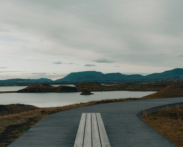Scenic view of Lake Mývatn with mountain backdrop